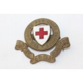 An awesome enamelled "The British Red Cross Society" cap badge