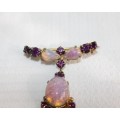 A stunning vintage gold plated ladies brooch with purple diamante and simulated Opal stones
