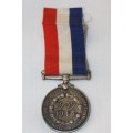 A spectacular and very scarce silver "South African - For War Services" medal w/ ribbon