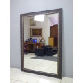 A fantastic large wall mirror w/ a fabulous wooden frame. Perfect in a large room.