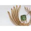 A beautiful vintage gold plated ladies brooch with a large square green Zirconia stone