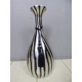 A beautiful floor standing vase. Gorgeous on its own or w/ large flower cuttings.