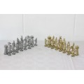 An amazing vintage/ antique? cast iron "Viking" silver & gold plated chess set in its original box