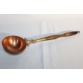 A Victorian antique copper and brass ladle with a wooden handle in very good condition