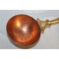 A Victorian antique copper and brass ladle with a wooden handle in very good condition