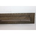 A very ornate solid brass mail slot that would look incredible in a larger door