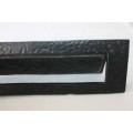 A cast iron mail slot that would look great in a larger door in very good condition