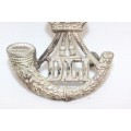 A fantastic British Army "Durham Light Infantry" white metal cap badge with Kings crown