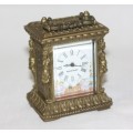 **RS17** A gorgeous ornate brass bevelled glass carriage clock w/ repousse detail & roman numerals