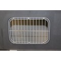 A large pet kennel/ travel case with two storage compartments on top