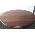A remarkable round Mahogany dining table with solid cast iron embellishments in stunning condition
