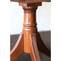 A remarkable round Mahogany dining table with solid cast iron embellishments in stunning condition
