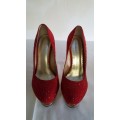 A beautiful pair of red diamante and gold "Fiorella" stiletto platform heels with ankle strap