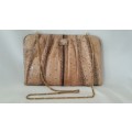 A beautiful light brown genuine snake skin ladies evening bag with a gold tone strap & locking clasp