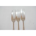 A fantastic set of three antique hallmarked Arthur Price & Co. sterling silver cake forks