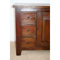 An exquisite solid oriental teak three-drawer cabinet w/ a good size cupboard in wonderful condition
