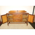 A stunning antique oak side server cabinet w/ loads of drawer and cupboard space in great condition