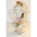 A stunning hand painted Italian made Capodimonte porcelain lidded jug