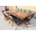 An amazing solid wooden 10-seater garden/ patio set including 10x chairs w/ cushions & extend table