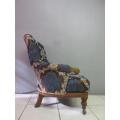 **RS17** A stylish Edwardian teak armchair w/ stunning upholstery & hand carved finishes on castors