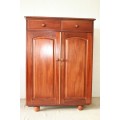 A superb and beautifully made teak entertainment/ TV unit with two drawers and slide-in doors