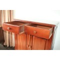 A superb and beautifully made teak entertainment/ TV unit with two drawers and slide-in doors