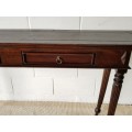An amazing vintage two-drawer hallway table w fluted legs and lovely hand carved detailing