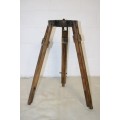 A fantastic antique metal and wood surveyor tripod in good condition for its impressive age