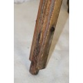 A fantastic antique metal and wood surveyor tripod in good condition for its impressive age