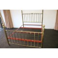An amazing vintage Queen-size brass bed with a stunning brass headboard and footboard.RS17Bed