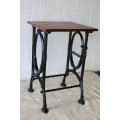 An amazing vintage cast iron sewing table with a wooden top - well made and very heavy!