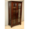 An incredibly well made solid Indonesian teak cabinet with glass shelves and beautiful slatted doors