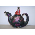 An amazing hand painted "Dragon" ceramic teapot with a hand painted "wizard" lid in great condition