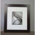 **RS17** A (large) black and white photograph of a spiral staircase in a broad-border frame