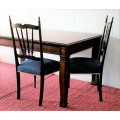 A stunning mahogany 6 to 8-seater dining table with stylish modern lines in excellent condition