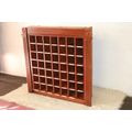 An awesome 49 bottle (floor cabinet) wine rack with individual wine bottle slots and sections