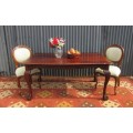An amazing vintage Imbuia dining table with oversized ball and claw feet in wonderful condition