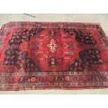 A wonderful vintage Persian Carpet (2.3m x 1.4m) in deep red, black and rust colours - stunning!