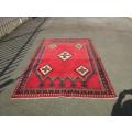 A magnificent vintage Iranian "Sirjani" Bokhtiari Kilim Persian carpet in vibrant red, blues, cream