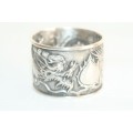 An incredible and rare Chinese solid silver "Dragon" napkin ring with amazing hand chased detailing