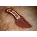 **RS17** A "surgical steel" Torro Model AS1003 "skinning" knife in its original leather sheath