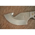 **RS17** A "surgical steel" Torro Model AS1003 "skinning" knife in its original leather sheath