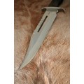A HUGE original 1988 Rambo III Bowie knife in its original box with the sheath and certificate