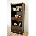 A wonderful tall teak display cabinet/ bookcase with shelves, storage cupboards and drawers