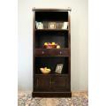 A wonderful tall teak display cabinet/ bookcase with shelves, storage cupboards and drawers