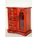 A wonderful wooden upright jewellery box with four drawers, ring slots & a rotating necklace holder