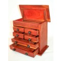An awesome hand made solid teak jewellery box with six drawers and a storage tray under the lid