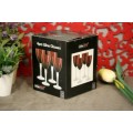 A stylish and modern boxed set of 4x tall wine glasses in a deep red colour with clear glass stems