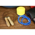 An incredible collection of gym exercise equipment including gloves, a skipping rope, weighs & more