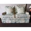 A wonderful "Moorgas & Sons" Brocade fabric couch with cushions & a floral pattern on it